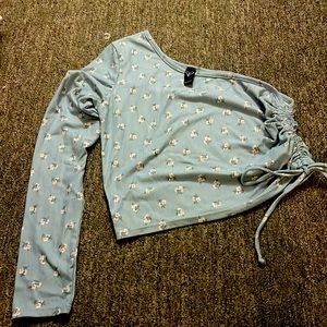 Size medium one sleeve crop shirt baby blue with lil flowers gathered on 1 side